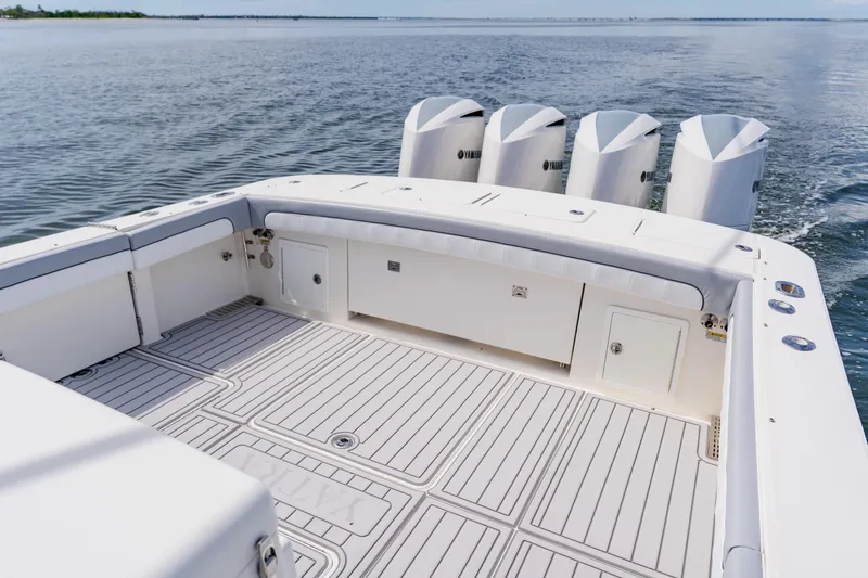 Slide: The Image of 2018 Regulator 41 boat deck with four Yamaha outboard engines on calm water. - 30