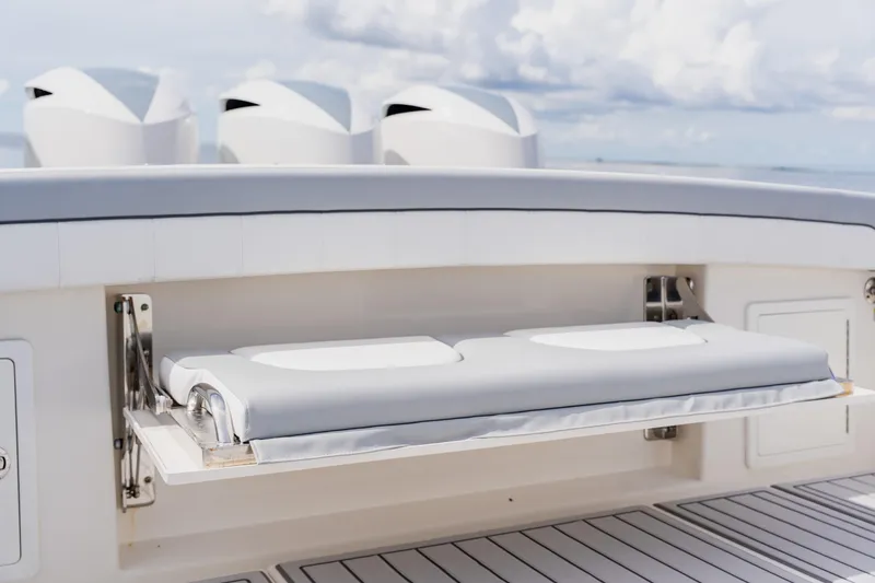 Slide: The Image of 2018 Regulator 41 boat with foldable cushioned seat and sleek design. - 35