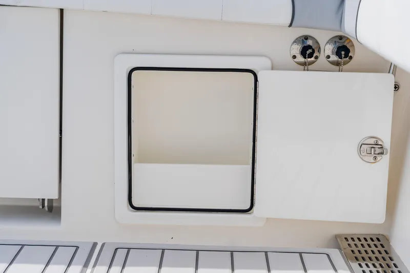 Slide: The Image of 2018 Regulator 41 boat storage compartment with open hatch and secure latch. - 36