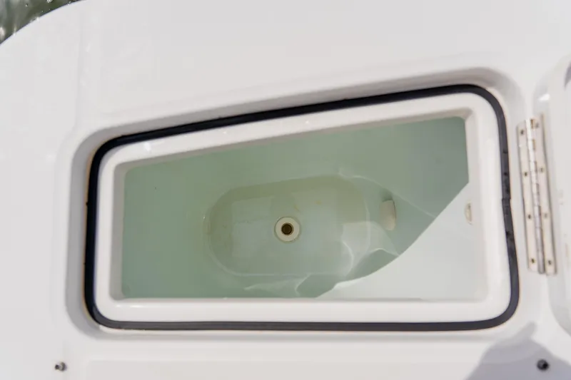 Slide: The Image of Livewell compartment on a 2018 Regulator 41 boat, featuring a white interior. - 38