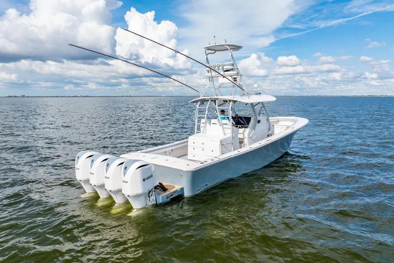 Slide: The Image of 2018 Regulator 41 boat with four Yamaha engines on open water. - 4