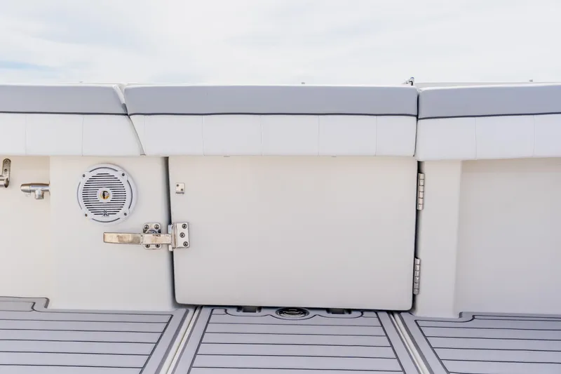 Slide: The Image of 2018 Regulator 41 boat interior with cushioned seating and speaker detail. - 40