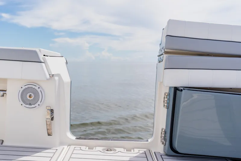 Slide: The Image of 2018 Regulator 41 boat deck with ocean view, featuring seating and speaker. - 41