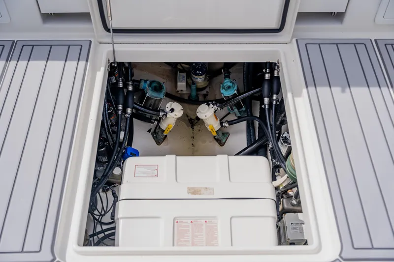 Slide: The Image of Engine compartment of a 2018 Regulator 41 boat, showcasing mechanical components and wiring. - 42