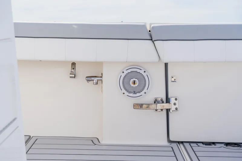 Slide: The Image of 2018 Regulator 41 boat interior with speaker and latch on white panel. - 53