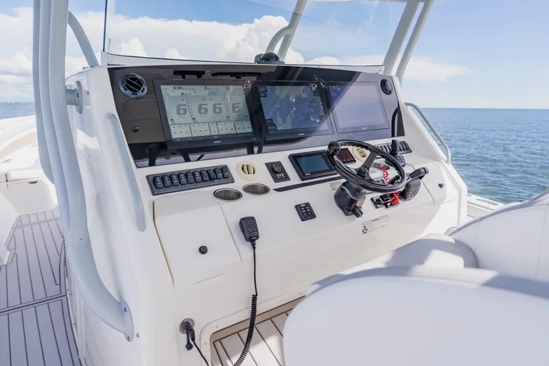 Slide: The Image of Control panel of a 2018 Regulator 41 boat with ocean view. - 59
