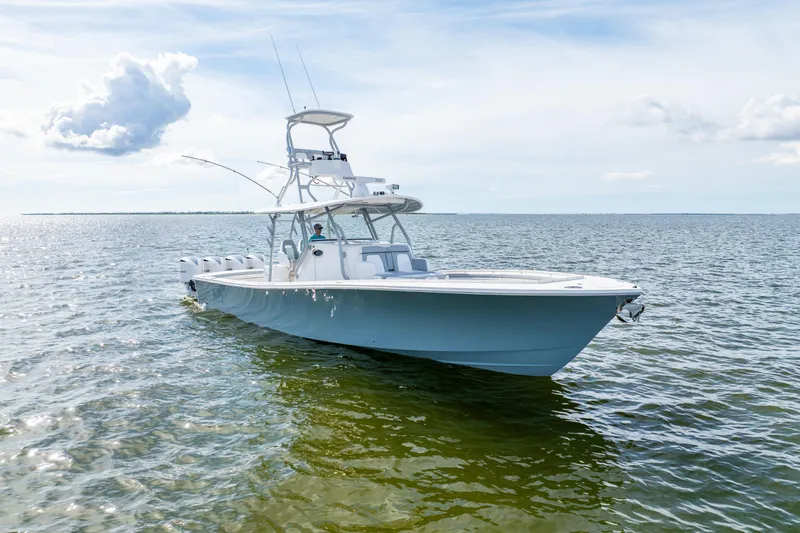 Slide: The Image of 2018 Regulator 41 boat on open water under a clear sky. - 6