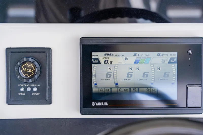 Slide: The Image of Control panel of a 2018 Regulator 41 boat with Yamaha display and ACR controls. - 62