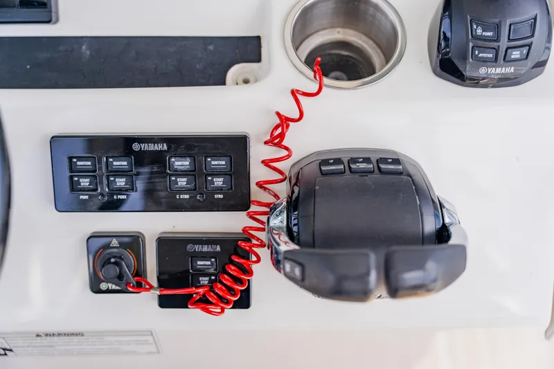 Slide: The Image of Control panel of a 2018 Regulator 41 boat featuring Yamaha components. - 64