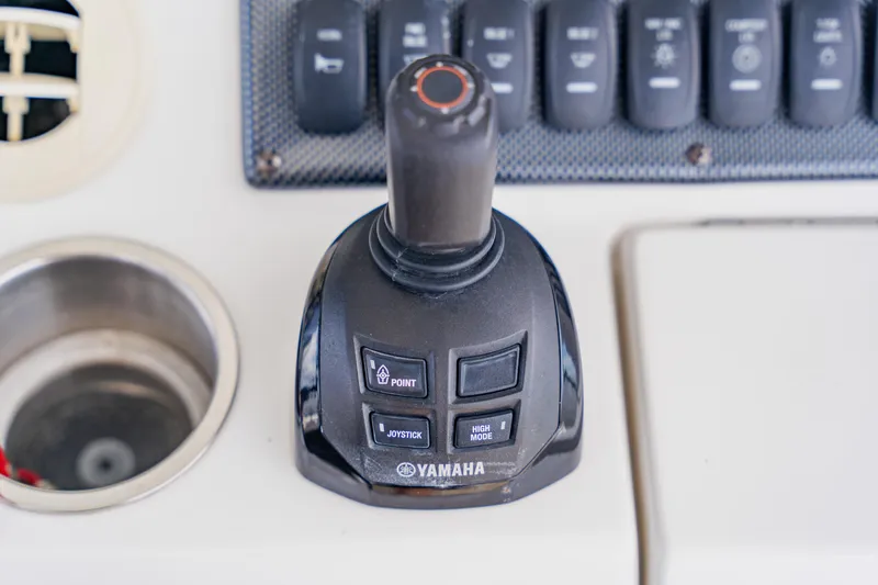 Slide: The Image of Yamaha joystick control on 2018 Regulator 41 boat dashboard. - 65