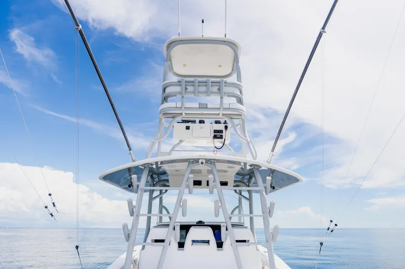 Slide: The Image of 2018 Regulator 41 boat tower against a clear blue sky and ocean backdrop. - 72