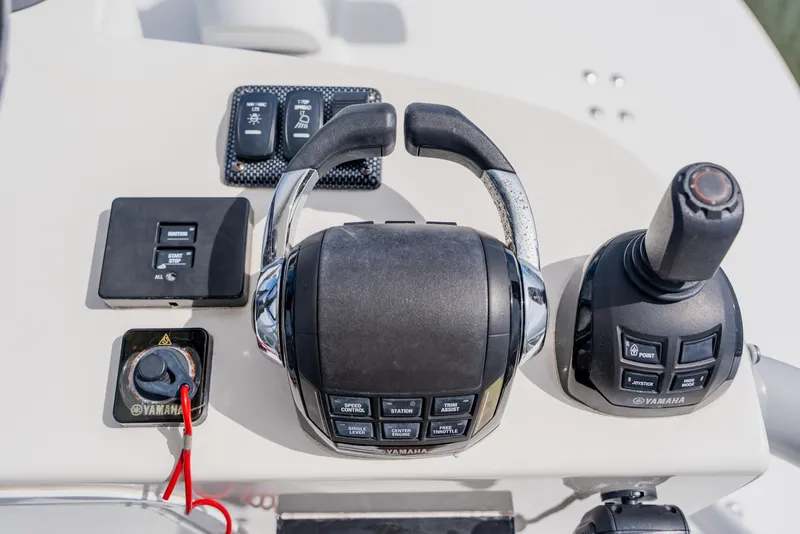 Slide: The Image of Control panel of a 2018 Regulator 41 boat with Yamaha throttle and joystick. - 75