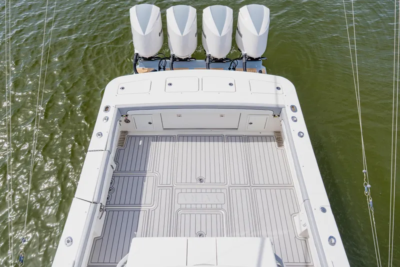 Slide: The Image of 2018 Regulator 41 boat deck with four outboard engines on water. - 78
