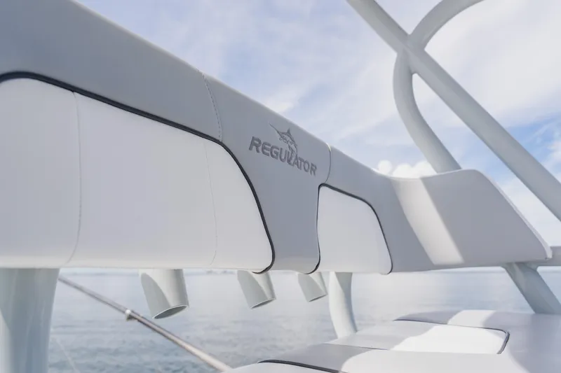 Slide: The Image of 2018 Regulator 41 boat seating detail with logo, ocean background. - 79
