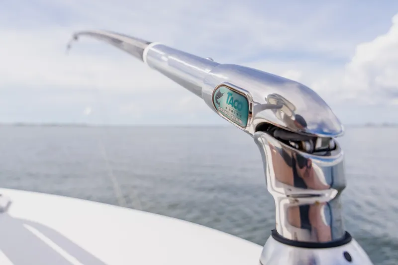 Slide: The Image of Close-up of a 2018 Regulator 41 boat's polished metal fitting against a serene ocean backdrop. - 80