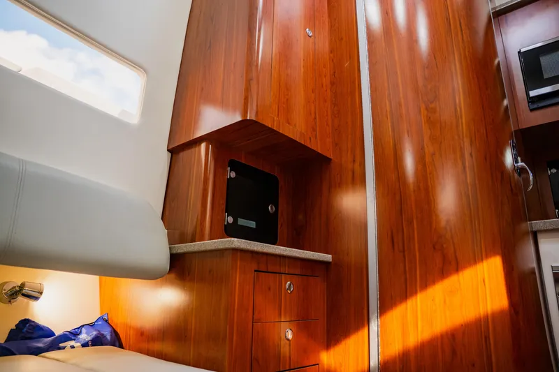 Slide: The Image of Interior of 2018 Regulator 41 boat with wooden cabinetry and modern design. - 87