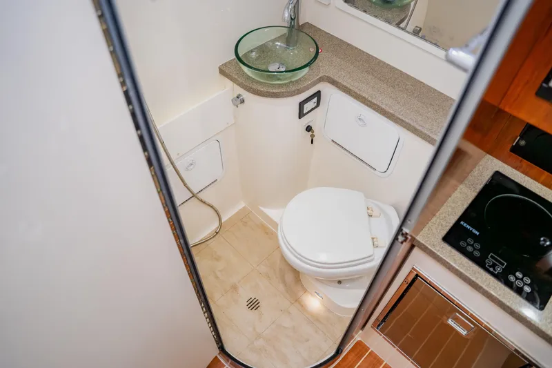Slide: The Image of 2018 Regulator 41 boat bathroom with glass sink and modern amenities. - 89