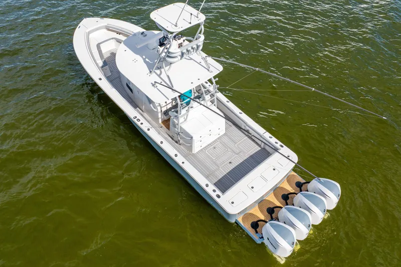 Slide: The Image of 2018 Regulator 41 boat with four engines on open water. - 9
