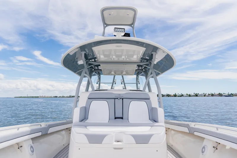 Slide: The Image of 2018 Regulator 41 boat on calm water under a clear blue sky. - 92