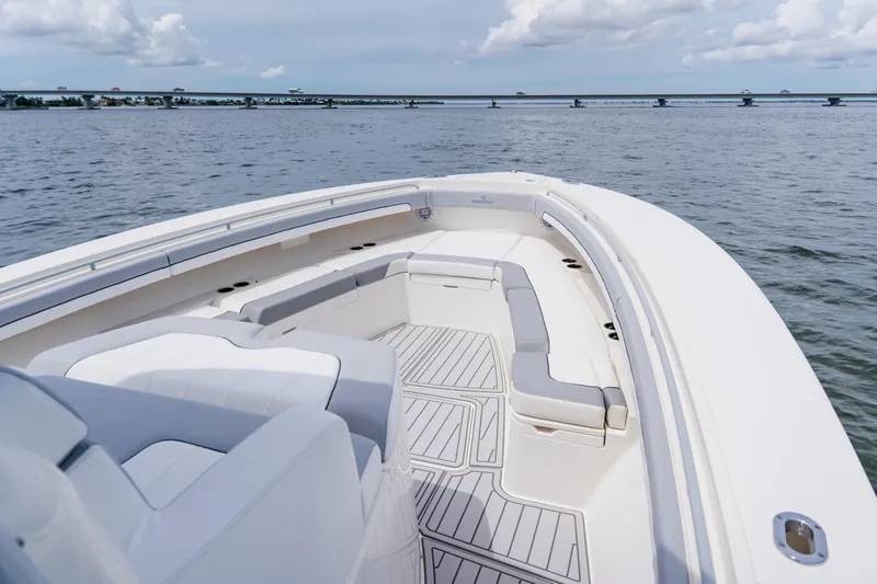 Slide: The Image of 2018 Regulator 41 boat with spacious seating on calm waters. - 95