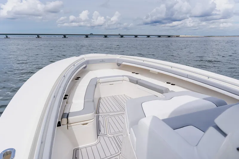 Slide: The Image of Luxurious 2018 Regulator 41 boat interior with spacious seating on calm waters. - 96
