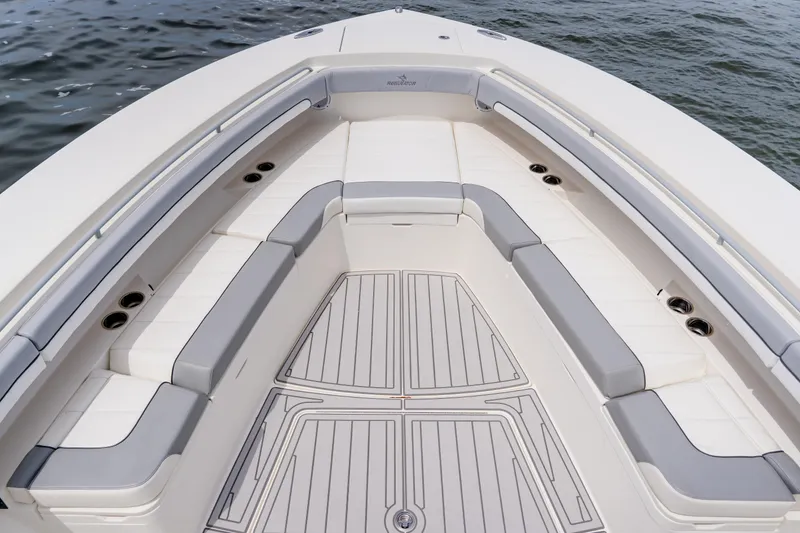 Slide: The Image of 2018 Regulator 41 boat with spacious seating and sleek design on the water. - 98