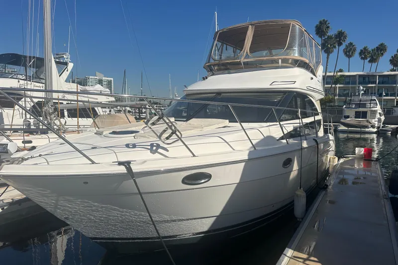 The Image of 2010 Meridian 391 Sedan yacht docked at marina under clear blue sky. - 1