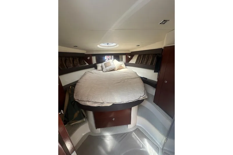Slide: The Image of Interior of 2010 Meridian 391 Sedan yacht with cozy bed and elegant wood finish. - 10