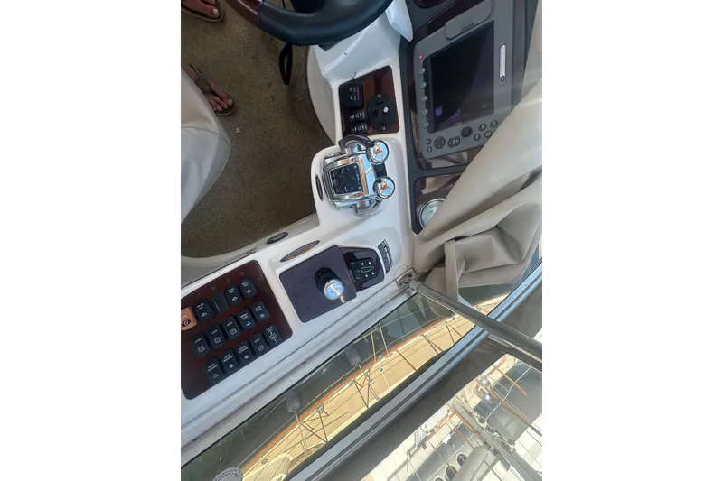 Slide: The Image of 2010 Meridian 391 Sedan helm with navigation controls and display screen. - 29