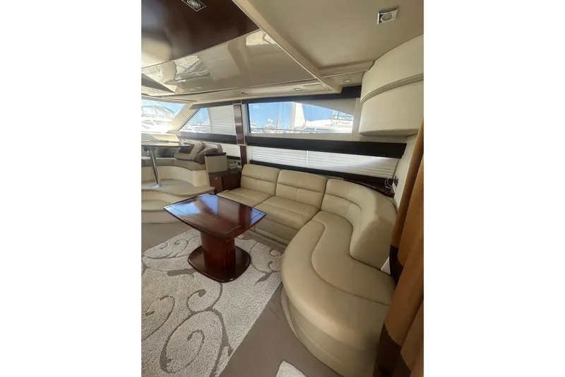Slide: The Image of Luxurious interior of 2010 Meridian 391 Sedan yacht with elegant seating and wooden table. - 4