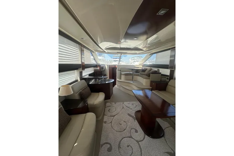 Slide: The Image of Luxurious interior of a 2010 Meridian 391 Sedan yacht with elegant furnishings and panoramic windows. - 6