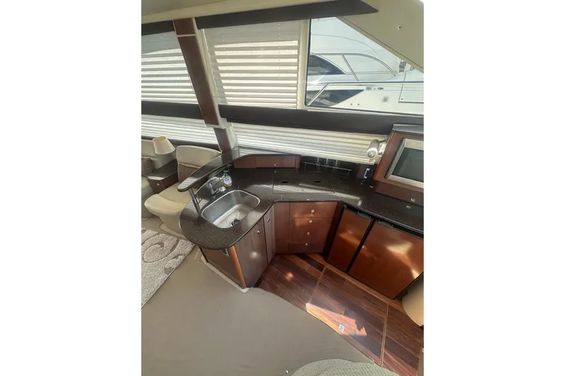 Slide: The Image of Interior of 2010 Meridian 391 Sedan yacht with modern kitchen amenities. - 7