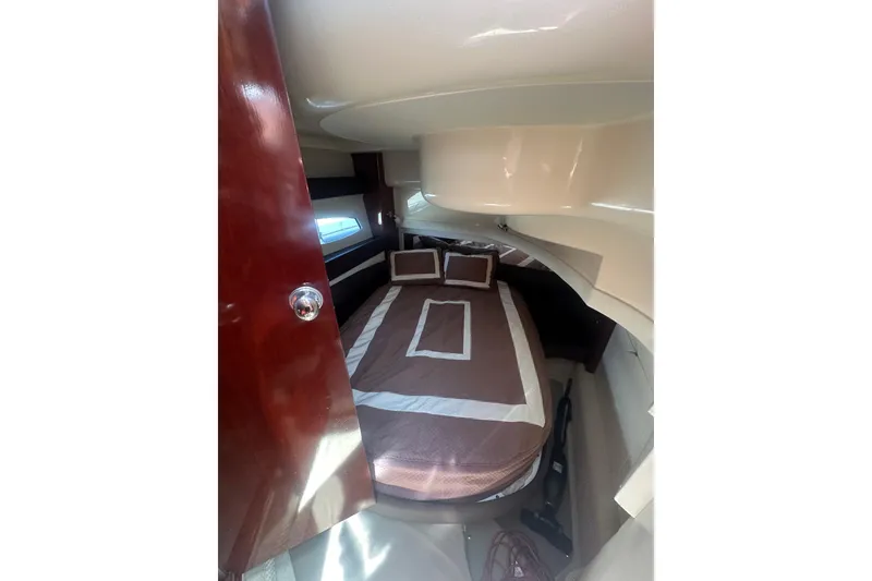 Slide: The Image of Interior cabin of 2010 Meridian 391 Sedan with cozy bed and wooden door. - 8