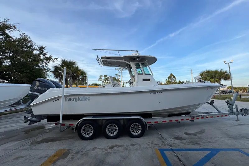 Slide: The Image of 2008 Everglades 290 Center Console boat on trailer, parked outdoors. - 10