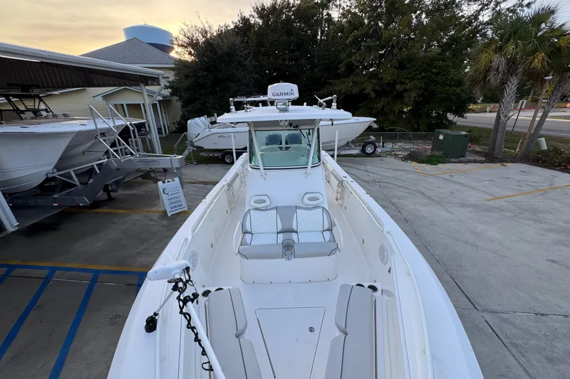 Slide: The Image of 2008 Everglades 290 Center Console boat docked at a marina. - 23