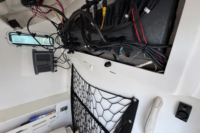 Slide: The Image of 2008 Everglades 290 Center Console interior wiring and storage view. - 29