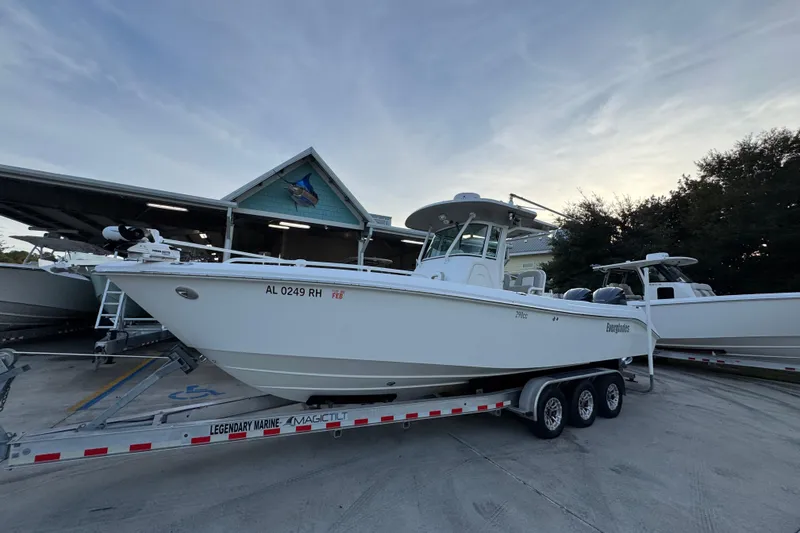 Slide: The Image of 2008 Everglades 290 Center Console boat on trailer at marina. - 3