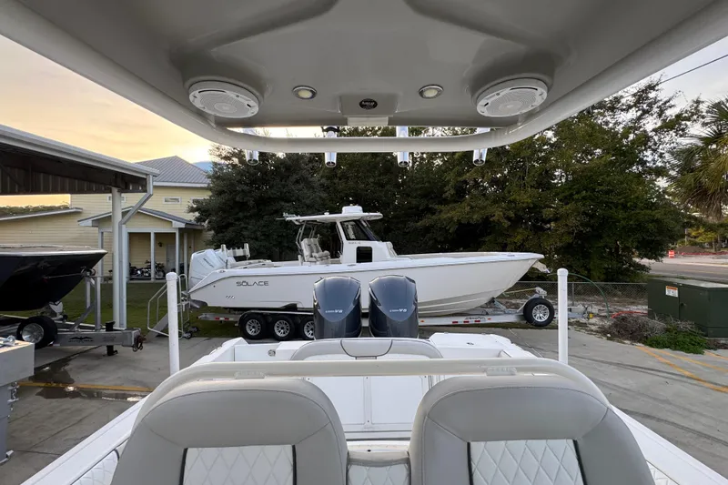 Slide: The Image of 2008 Everglades 290 Center Console boat with dual engines, parked on a trailer. - 32