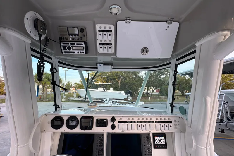 Slide: The Image of 2008 Everglades 290 Center Console boat dashboard with navigation and communication equipment. - 35