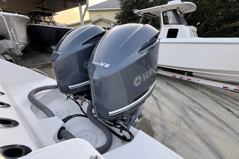 Slide: The Image of 2008 Everglades 290 Center Console with twin Yamaha V8 engines in a boatyard. - 43