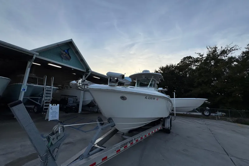 Slide: The Image of 2008 Everglades 290 Center Console boat on trailer at marina, evening sky. - 5