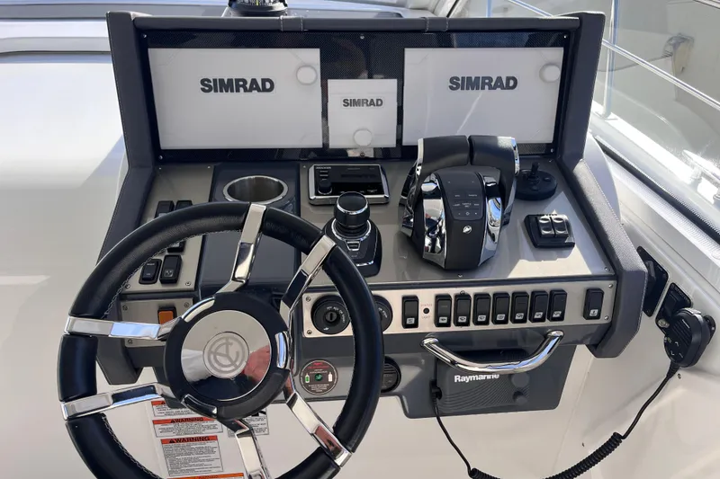 Slide: The Image of Helm of 2018 Cruisers Yachts 390 Express Coupe with Simrad navigation system. - 10