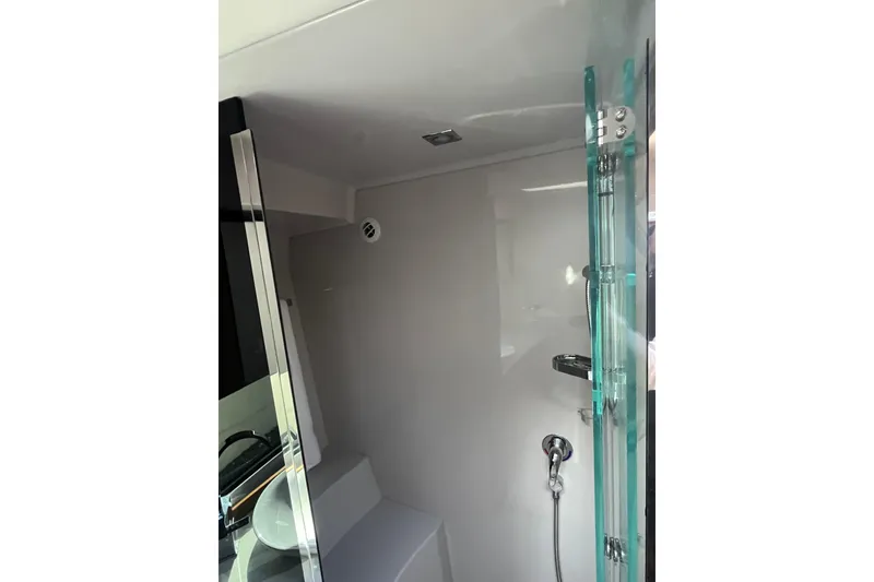 Slide: The Image of 2018 Cruisers Yachts 390 Express Coupe bathroom with modern shower design. - 7