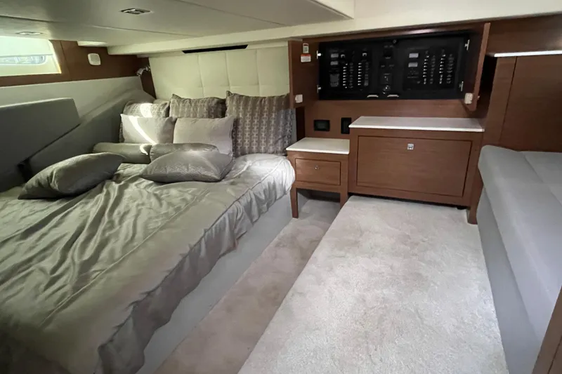 Slide: The Image of Luxurious cabin interior of 2018 Cruisers Yachts 390 Express Coupe with plush bedding. - 8