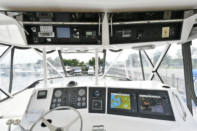 Slide: The Image of Cockpit view of 1997 Viking 47 Convertible yacht with navigation instruments and steering wheel. - 10