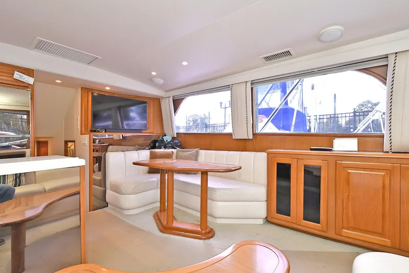 Slide: The Image of Interior of 1997 Viking 47 Convertible yacht with elegant seating and wooden cabinetry. - 21