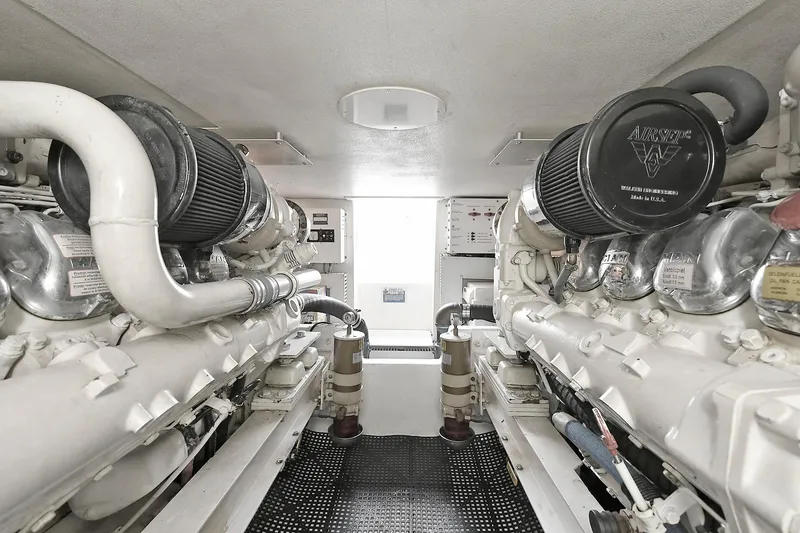 Slide: The Image of Engine room of a 1997 Viking 47 Convertible yacht, showcasing dual engines. - 33