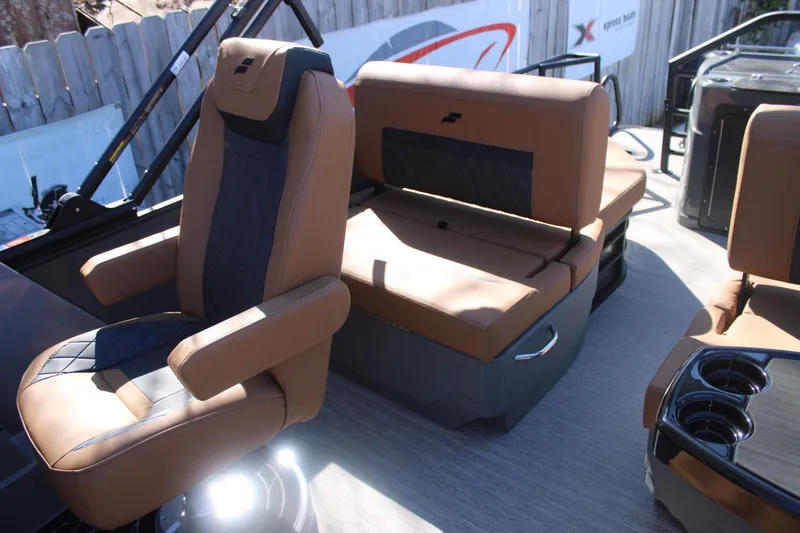 Slide: The Image of 2026 Starcraft SLS 3 RL boat interior with luxurious brown seating and cup holders. - 13