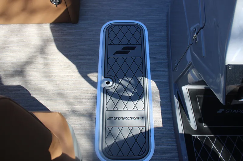 Slide: The Image of 2026 Starcraft SLS 3 RL boat interior with branded flooring and seating. - 20