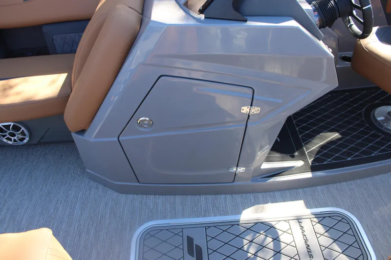 Slide: The Image of 2026 Starcraft SLS 3 RL boat interior with gray console and tan seating. - 22